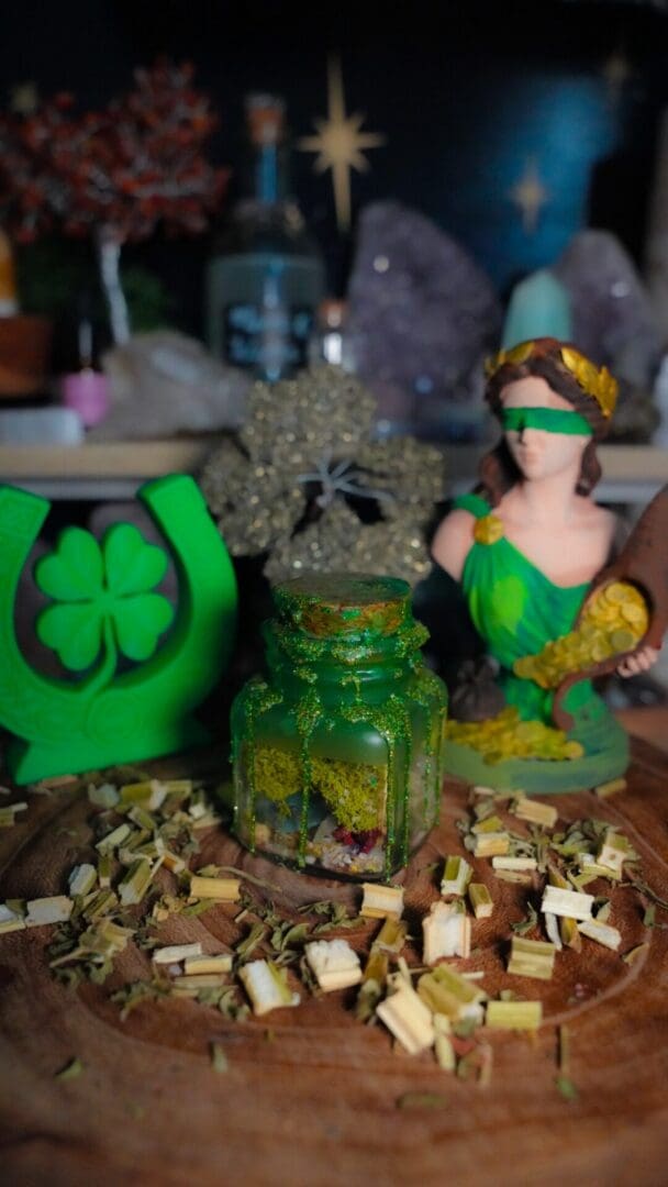 Green jar with herbs, blindfolded figurine
